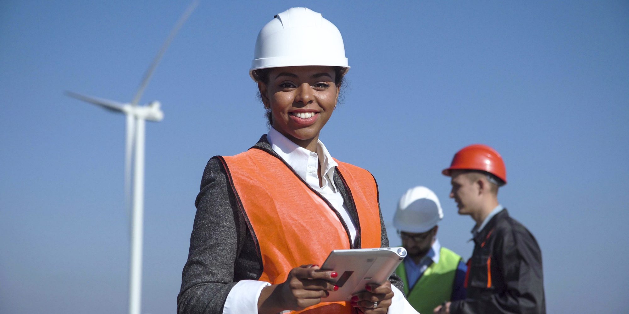 Woman In Group With Hardhats Aspect Ratio 1160 580