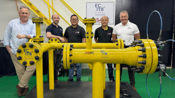 ECITB Director Rory Blyth (second left) by an MJI rig with the team at training provider Jasable in Malaysia
